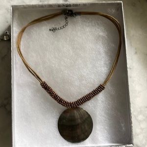 Beautiful neutral colors in this necklace with adjustable clasp